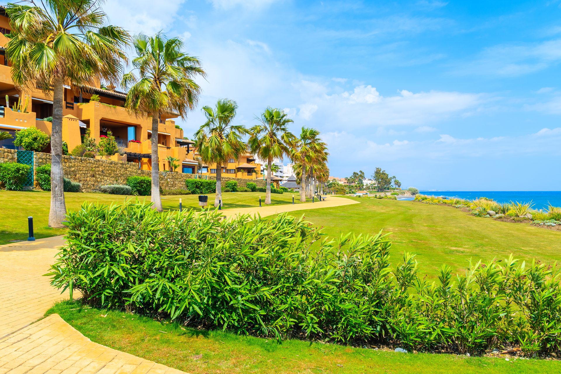 Luxury villa with ocean view, private pool, and tropical landscaping.